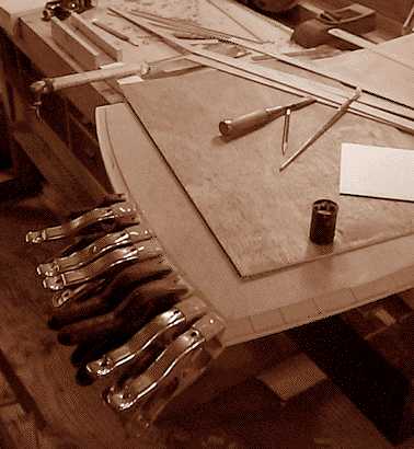 Image showing the process of applying the edging of this pearwood writing desk
